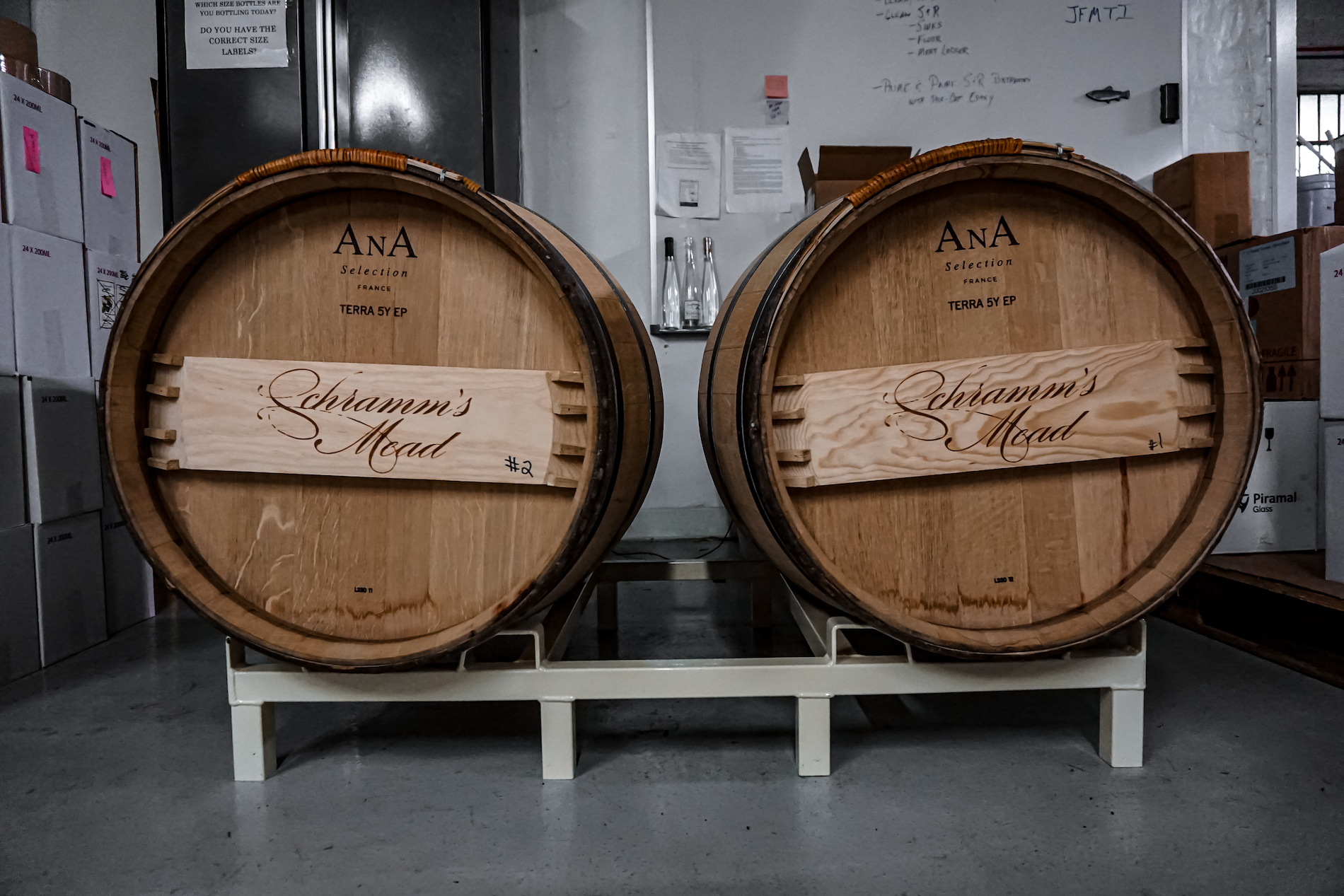 Two wooden barrels on their side reading Schramm's Mead